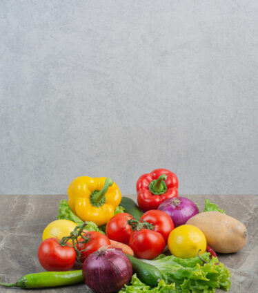 A lot of fresh vegetables on marble background. High quality photo